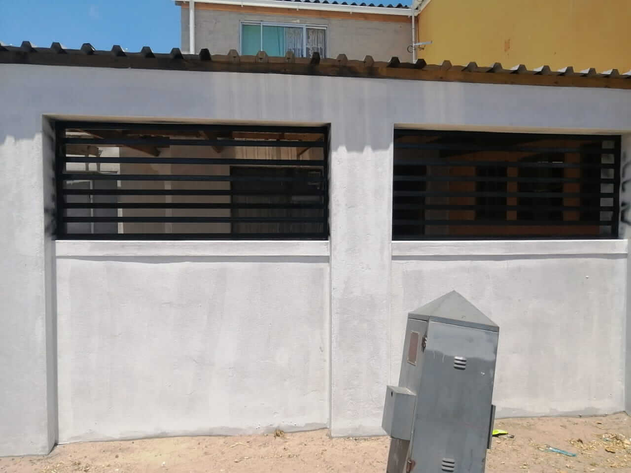 Plastered wall and steel window burglar bars installation in Cape Town